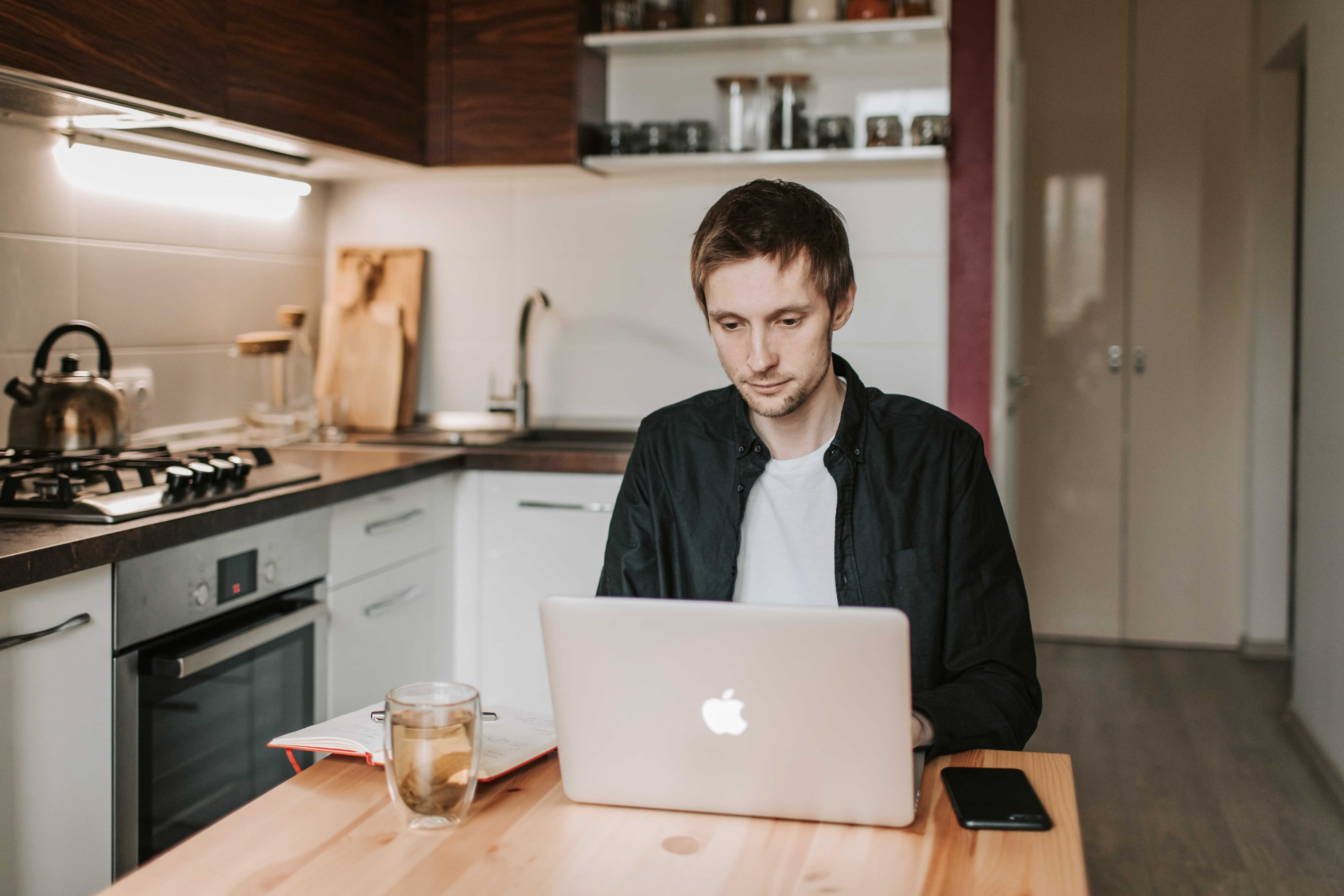 man working from home in kitchen